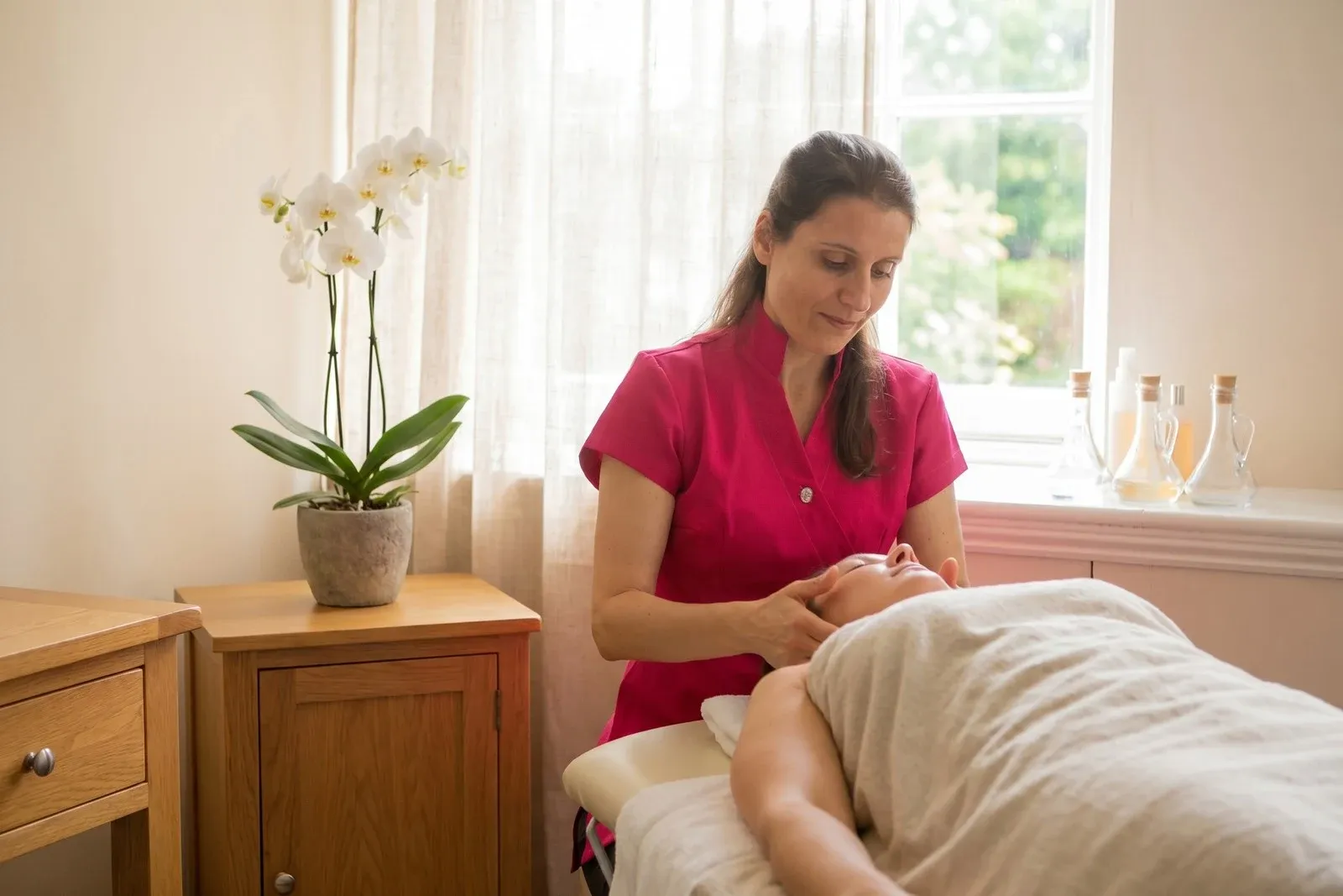 A warm treatment room set for massage at ProActive Therapies, Honingham